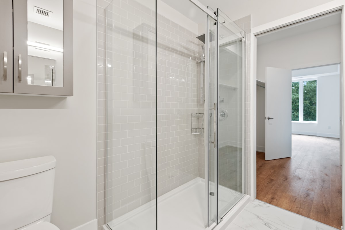Clear glass door with a white frame